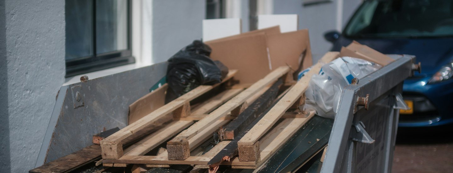Dumpster filled with wood and debris from a junk removal job in Ottawa
